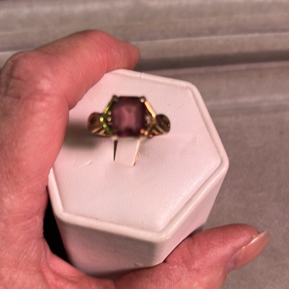 Beautiful ring and gold color, purple stone